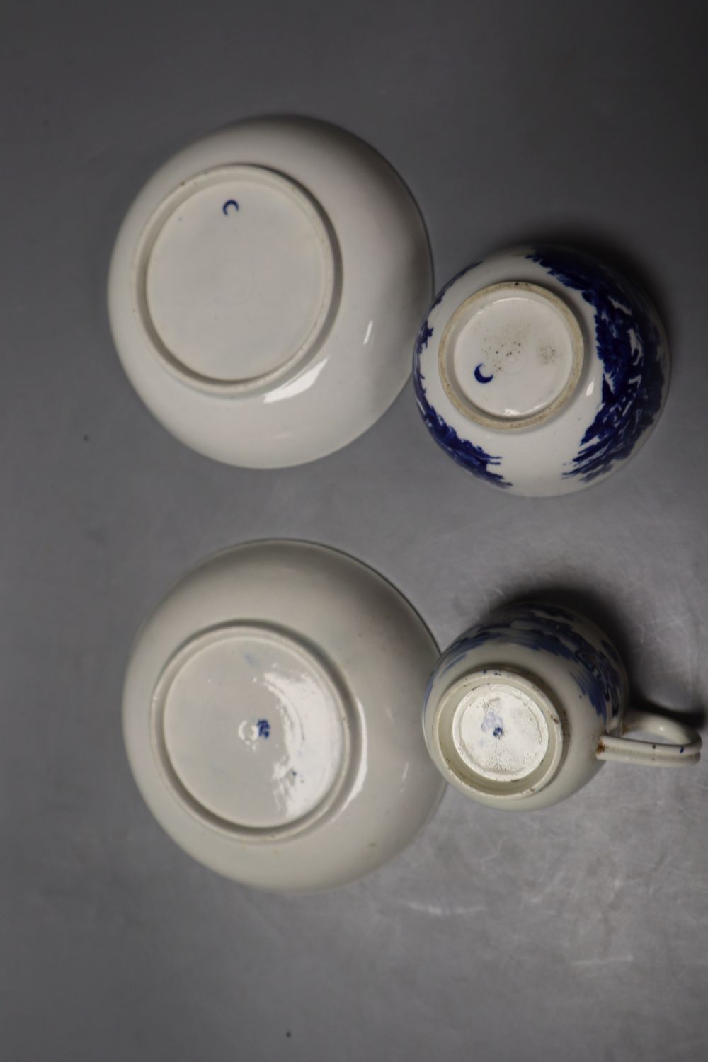 A Worcester Bat pattern coffee cup and saucer and a European Landscape teabowl and saucer